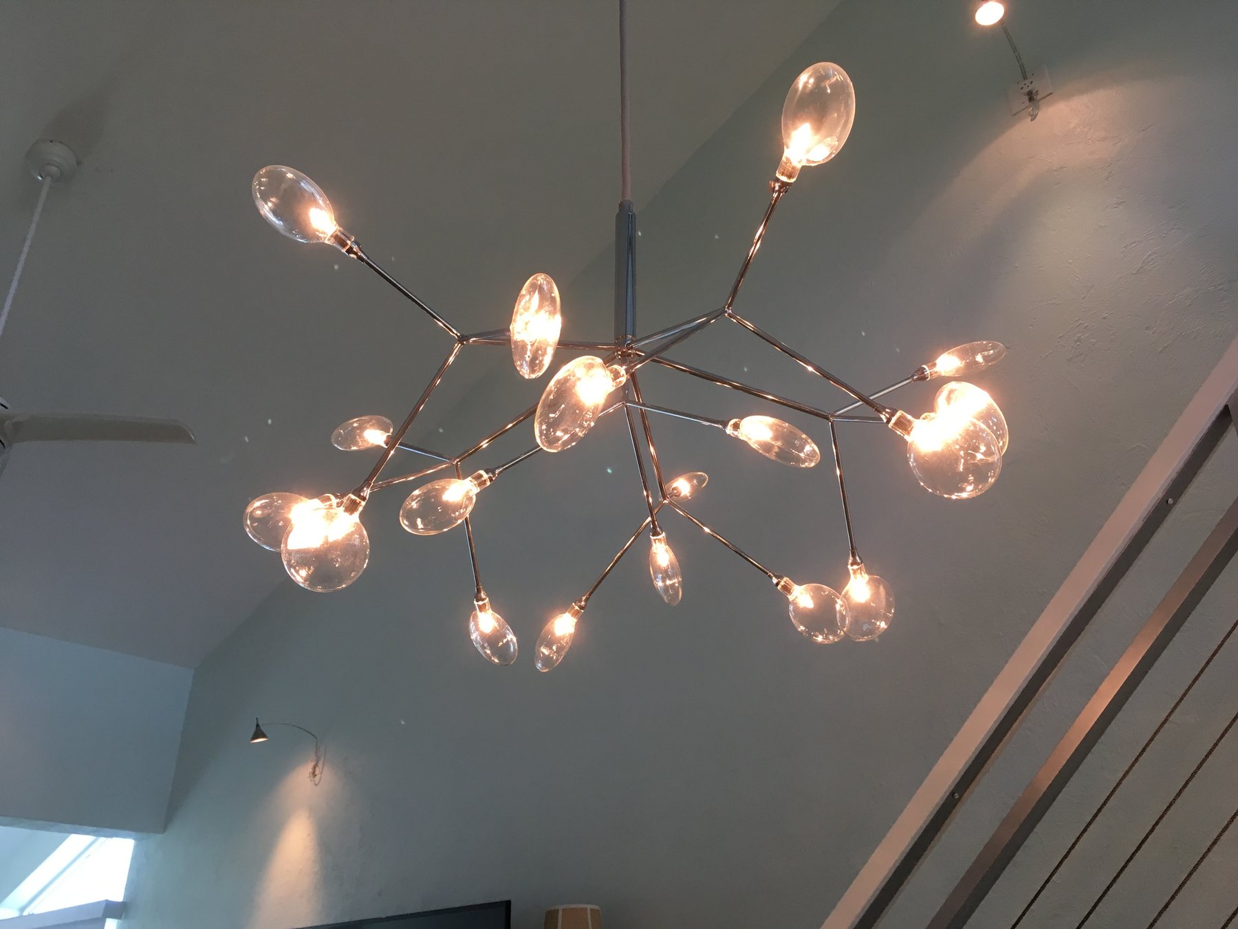 Sculptural lighting above the stair
